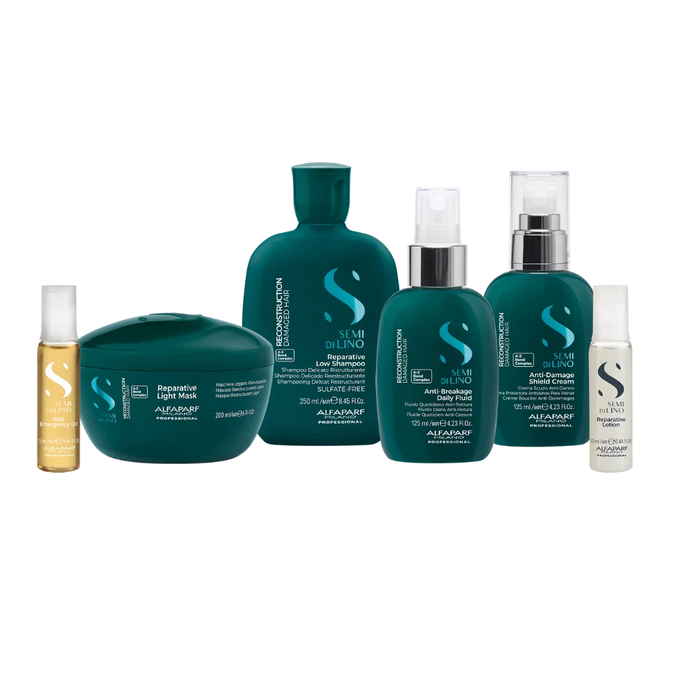 Colección completa de productos Alfaparf Milano Semi di Lino Reconstruction para cabellos dañados: incluye aceite SOS Emergency Oil, mascarilla Reparative Light Mask, shampoo Reparative Low Shampoo, fluido Anti-Breakage Daily Fluid, crema protectora Anti-Damage Shield Cream y loción reparadora Reparative Lotion.