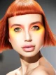 Modelo con corte bob corto en tono cobre brillante, maquillaje naranja intenso, colección Freedom por Kerry Mather.