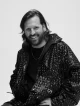 Retrato sonriente de Jorge X artista de Quantum Hair