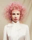 Rizos cortos voluminosos en rosa pastel; acabado etéreo de la Colección Dandy — Sassoon Academy.