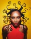 Modelo con trenzas artísticas en espiral de la colección Verve de Project Afro, con maquillaje gráfico y fondo amarillo.